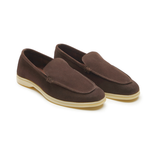 Pair of brown loafers on a white background