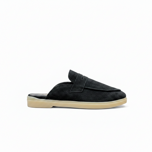 A single black suede mule slipper with a beige sole, shown in a side profile view against a plain white background.