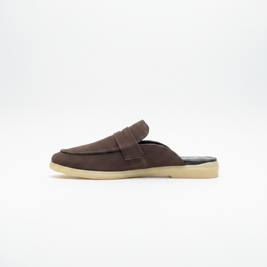 A dark brown leather slip-on loafer mule with a matching strap and a light beige sole, shown in profile against a plain white background.