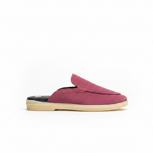 A single slip-on mule shoe in dusty rose pink suede with a beige sole, shown in profile against a plain white background.